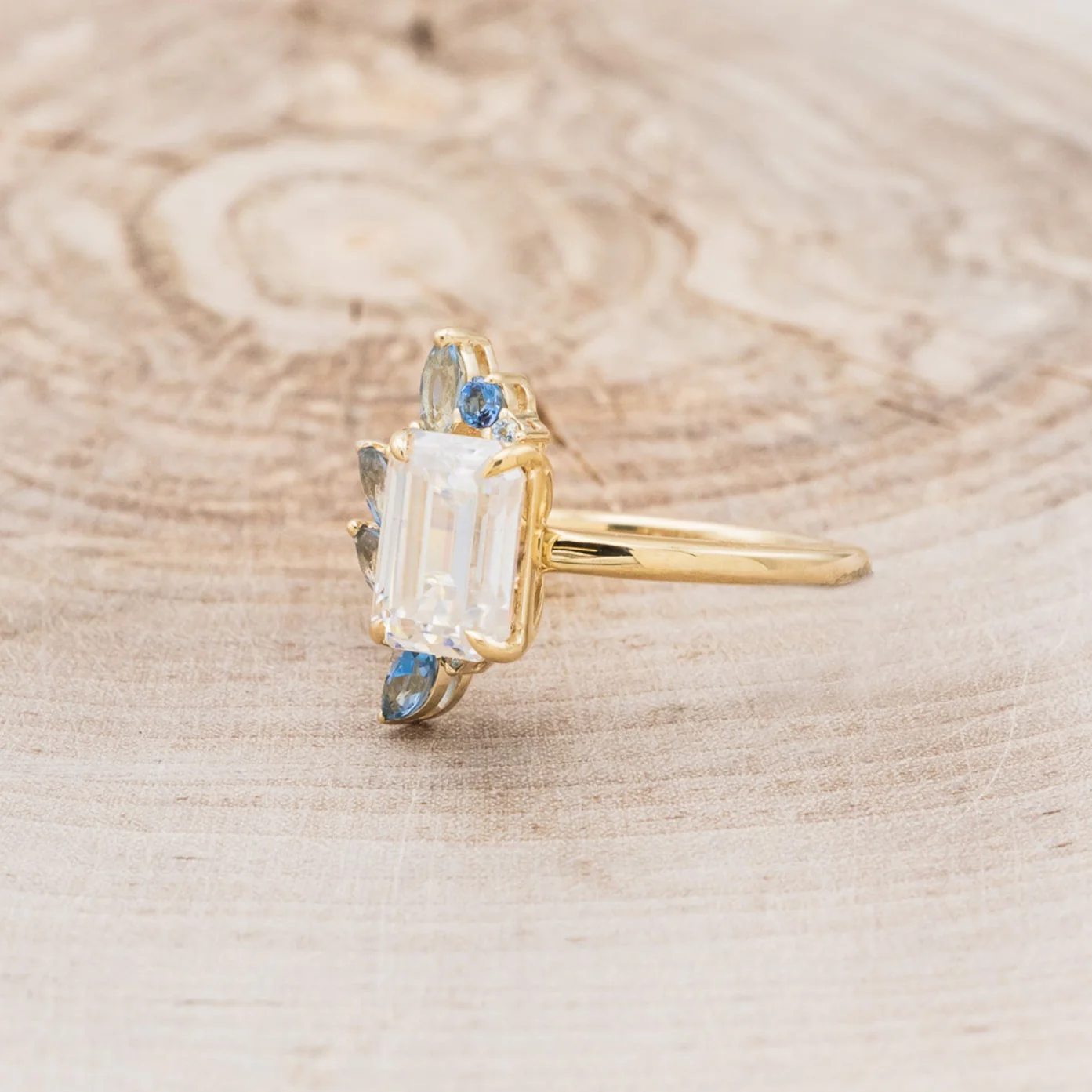 "ISABELLA" - EMERALD CUT MOISSANITE ENGAGEMENT RING WITH AQUAMARINE ACCENTS - Image 3